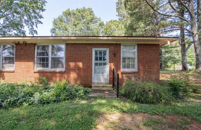 867 Lexington Hwy, Loretto, TN 38469 - view of front of house featuring brick siding and entry steps