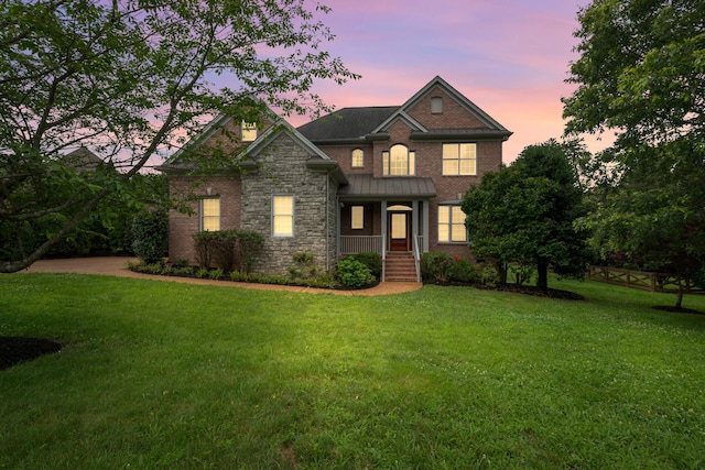 7157 Chessington Dr, Fairview, TN 37062 - view of front facade featuring a yard, stone siding, and brick siding