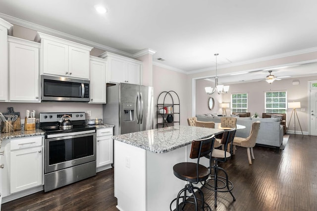 4316 Summercrest Blvd Unit 104, Antioch, TN 37013 - kitchen with stainless steel appliances, open floor plan, dark wood-style floors, ornamental molding, and white cabinets