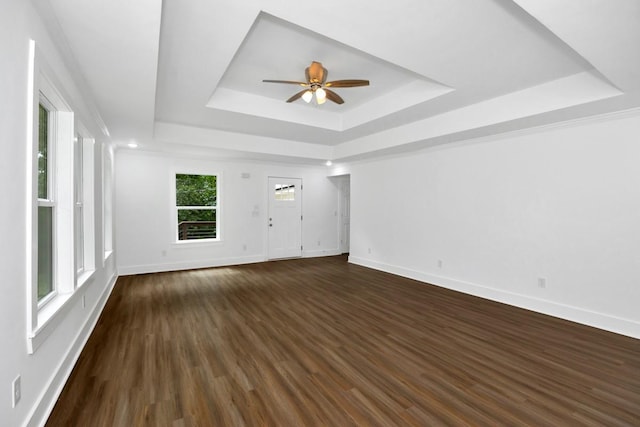 475 Kelly Creek Rd, Ardmore, TN 38449 - spare room featuring a raised ceiling, a ceiling fan, and dark wood-style flooring