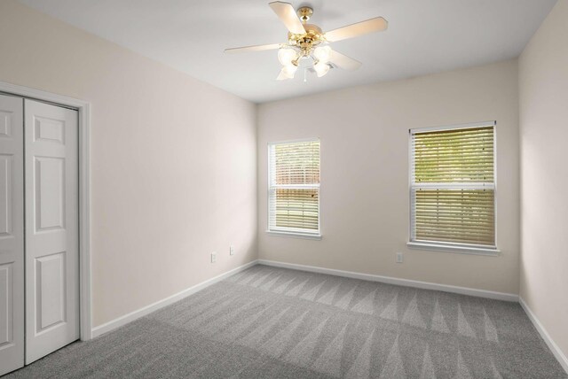 1101 Downs Blvd Unit 112, Franklin, TN 37064 - carpeted spare room featuring a ceiling fan and baseboards