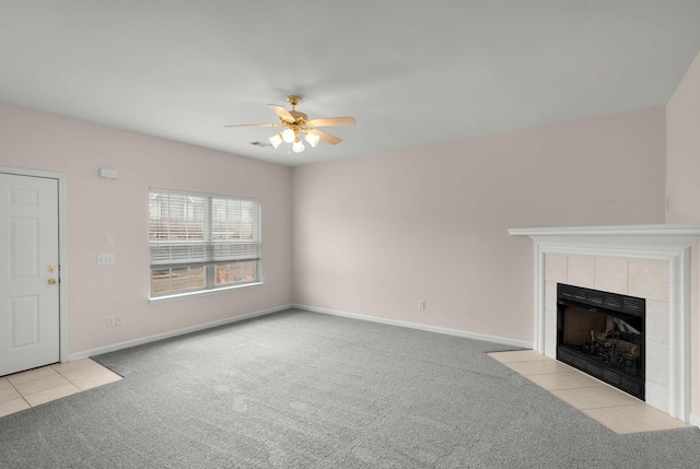 1101 Downs Blvd Unit 112, Franklin, TN 37064 - unfurnished living room featuring carpet flooring, ceiling fan, a tile fireplace, and tile patterned flooring