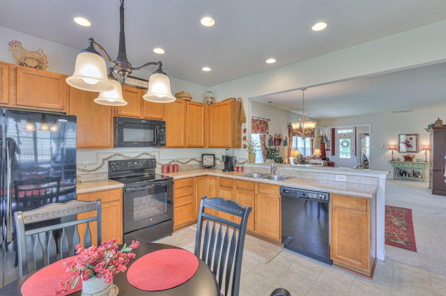 403 Independence St, Mount Juliet, TN 37122 - kitchen featuring black appliances, a peninsula, a chandelier, light countertops, and recessed lighting