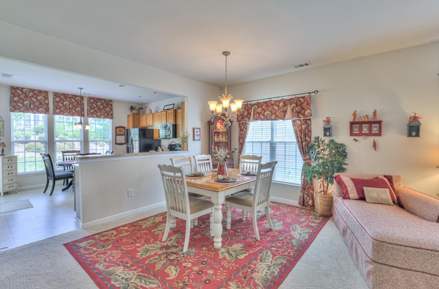 403 Independence St, Mount Juliet, TN 37122 - dining area featuring a chandelier, plenty of natural light, and light colored carpet