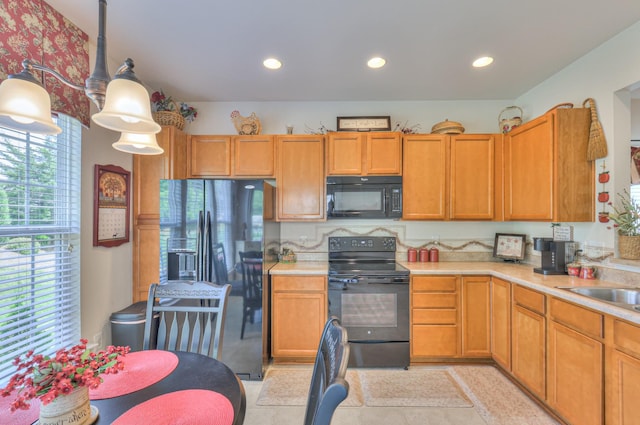 403 Independence St, Mount Juliet, TN 37122 - kitchen with black appliances, light countertops, recessed lighting, and decorative light fixtures