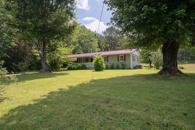 399 Indian Creek Rd, Hohenwald, TN 38462 - view of grassy yard featuring covered porch