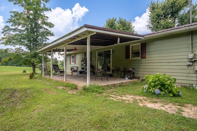 399 Indian Creek Rd, Hohenwald, TN 38462 - back of property with a yard and a patio