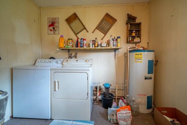 399 Indian Creek Rd, Hohenwald, TN 38462 - laundry area with water heater, washing machine and dryer, carpet flooring, and wood walls