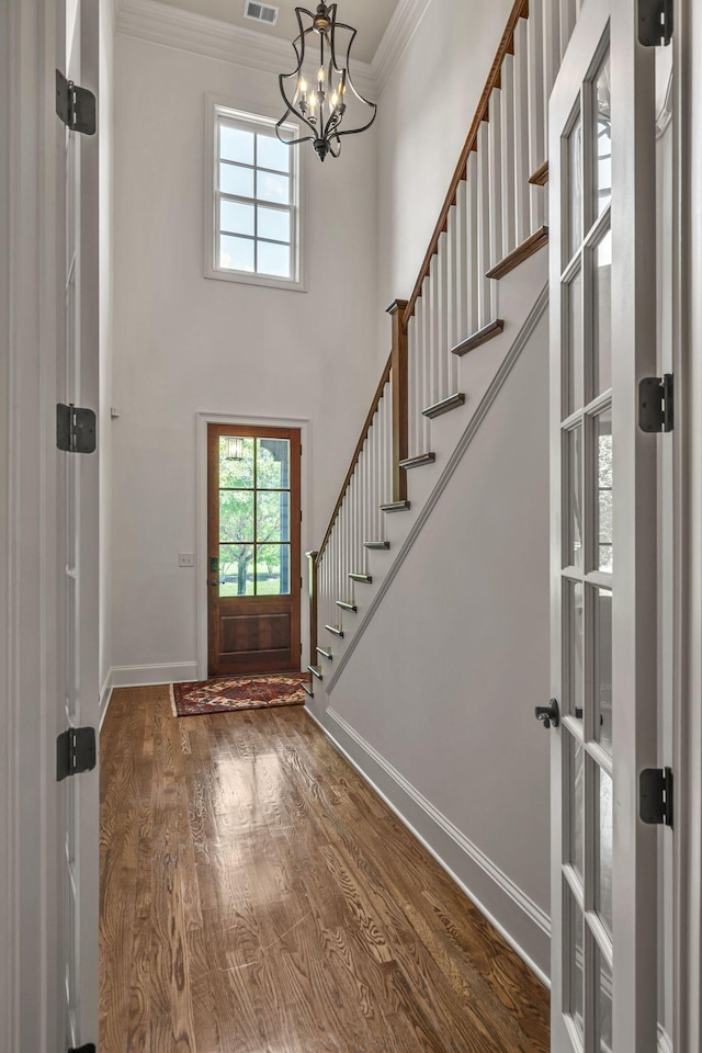 1353 Eliot Rd, Franklin, TN 37064 - foyer with a chandelier, ornamental molding, healthy amount of natural light, dark wood-style floors, and stairs