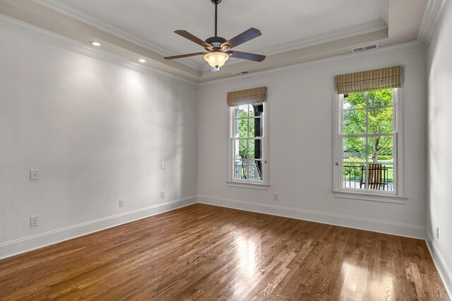 1353 Eliot Rd, Franklin, TN 37064 - empty room featuring healthy amount of natural light, ceiling fan, wood finished floors, a raised ceiling, and crown molding