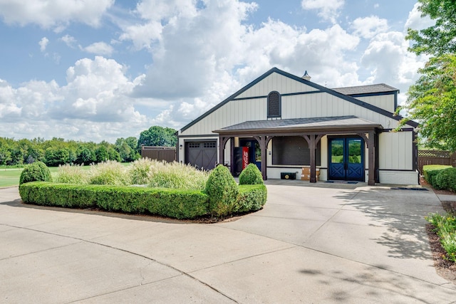 1353 Eliot Rd, Franklin, TN 37064 - view of front facade featuring an attached garage and concrete driveway
