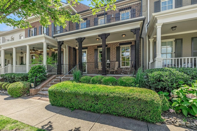 1353 Eliot Rd, Franklin, TN 37064 - property entrance with brick siding, a porch, a ceiling fan, and a balcony
