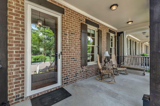 1353 Eliot Rd, Franklin, TN 37064 - property entrance featuring a porch and brick siding
