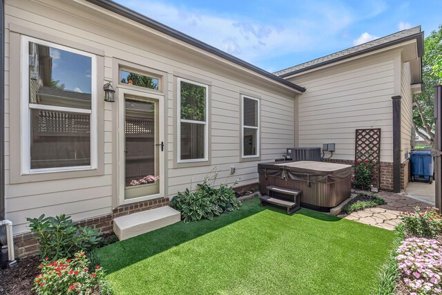 1353 Eliot Rd, Franklin, TN 37064 - back of property featuring a hot tub, a lawn, and entry steps