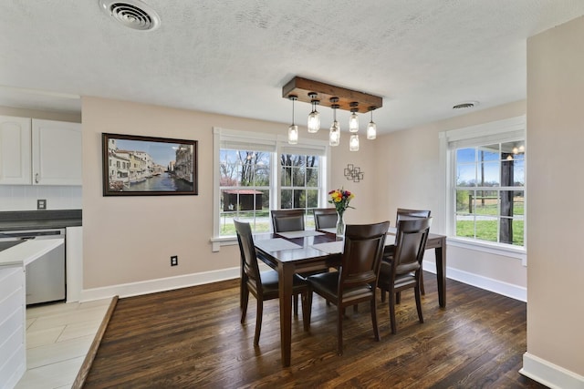 3717 Atkins Rd, Cedar Hill, TN 37032 - dining room with wood finished floors, plenty of natural light, and a textured ceiling
