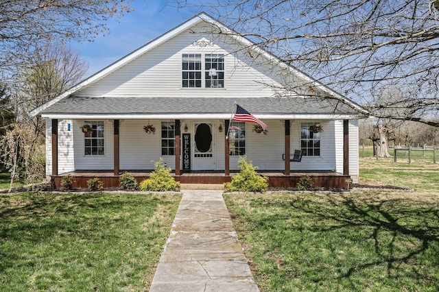 3717 Atkins Rd, Cedar Hill, TN 37032 - view of front of property featuring covered porch, a front yard, and a shingled roof