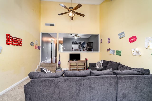 1053 Heritage Dr, Madison, TN 37115 - living area featuring ceiling fan, carpet, and high vaulted ceiling