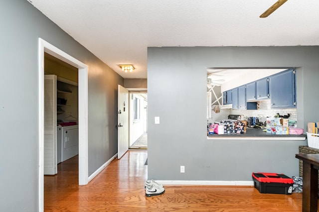 1053 Heritage Dr, Madison, TN 37115 - hallway featuring independent washer and dryer and light wood-style flooring