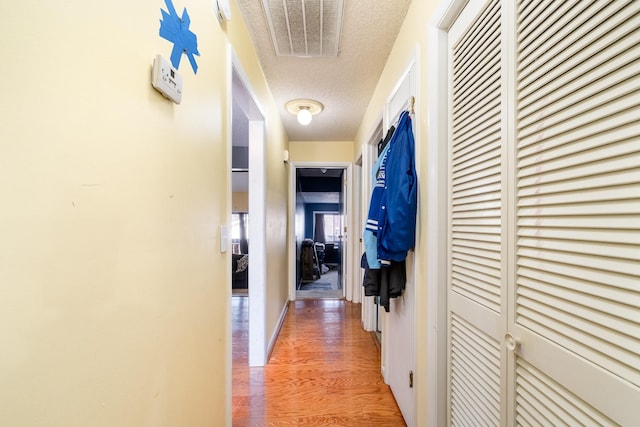 1053 Heritage Dr, Madison, TN 37115 - corridor featuring a textured ceiling and light wood finished floors