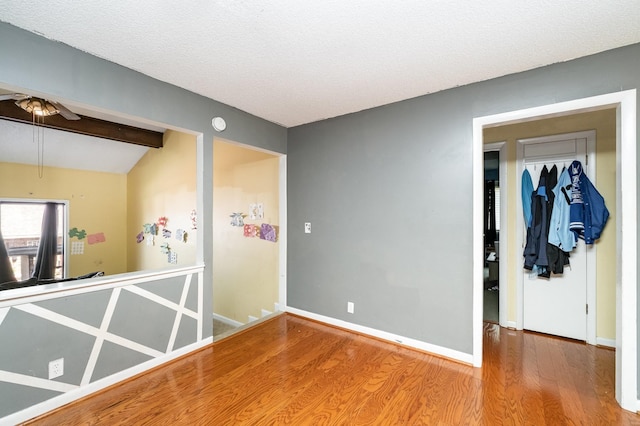 1053 Heritage Dr, Madison, TN 37115 - empty room with wood finished floors, a ceiling fan, and a textured ceiling
