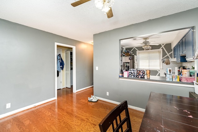 1053 Heritage Dr, Madison, TN 37115 - dining room with a ceiling fan, wood finished floors, and a textured ceiling