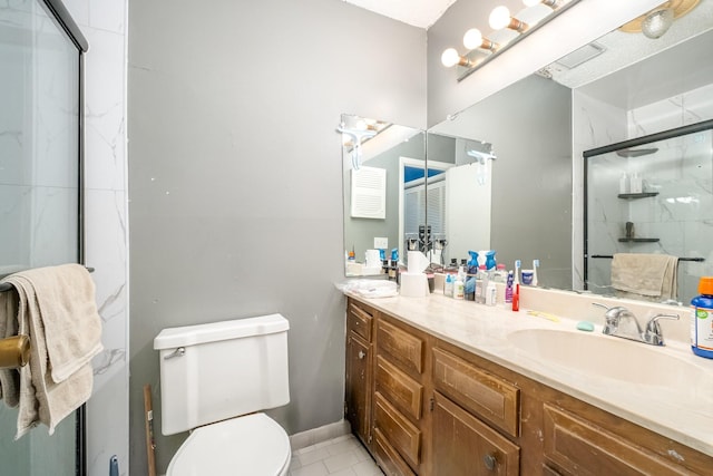 1053 Heritage Dr, Madison, TN 37115 - bathroom featuring a marble finish shower, vanity, and tile patterned floors