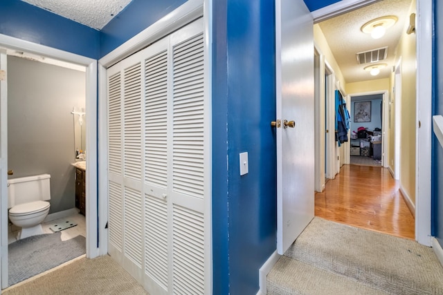 1053 Heritage Dr, Madison, TN 37115 - corridor featuring carpet and a textured ceiling