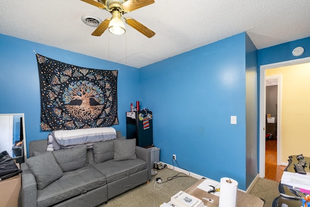 1053 Heritage Dr, Madison, TN 37115 - living room with ceiling fan, carpet floors, and a textured ceiling