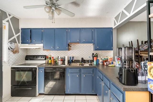 1053 Heritage Dr, Madison, TN 37115 - kitchen with black dishwasher, range with electric cooktop, under cabinet range hood, blue cabinetry, and light tile patterned flooring
