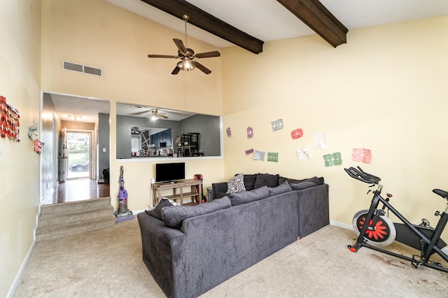 1053 Heritage Dr, Madison, TN 37115 - carpeted living area featuring a ceiling fan, beamed ceiling, and high vaulted ceiling