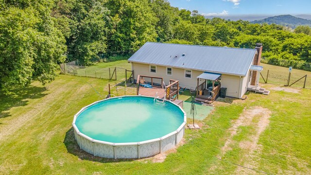 6857 Pulltight Hill Rd, College Grove, TN 37046 - view of pool with a wooden deck and a forest view