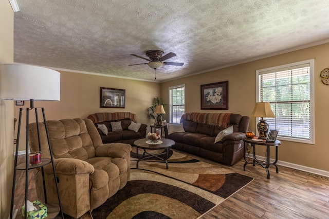 3090 Algee Ln, Milan, TN 38358 - living room featuring wood finished floors, a textured ceiling, a ceiling fan, and crown molding
