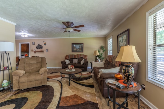 3090 Algee Ln, Milan, TN 38358 - living area featuring healthy amount of natural light, ceiling fan, crown molding, and a textured ceiling