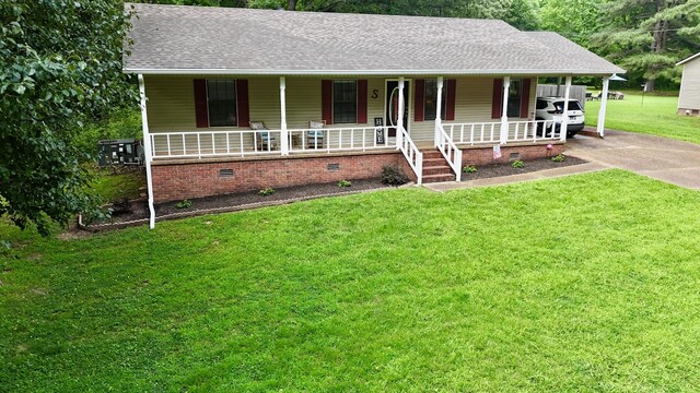 3090 Algee Ln, Milan, TN 38358 - view of front of home featuring covered porch, crawl space, a shingled roof, a front lawn, and concrete driveway