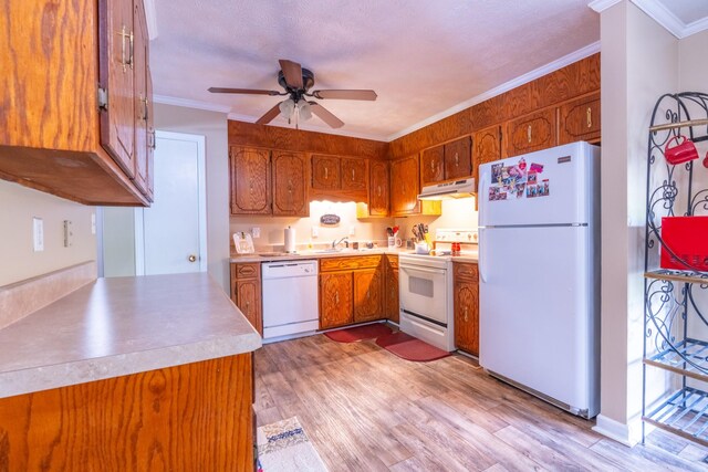 3090 Algee Ln, Milan, TN 38358 - kitchen featuring white appliances, brown cabinetry, under cabinet range hood, a ceiling fan, and ornamental molding