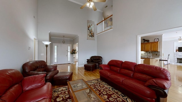 5142 Reagan Dr, Murfreesboro, TN 37129 - living area featuring ceiling fan, light wood-style flooring, a towering ceiling, and ornamental molding
