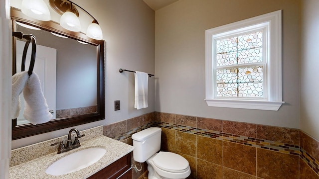 5142 Reagan Dr, Murfreesboro, TN 37129 - half bathroom with tile walls, vanity, and wainscoting