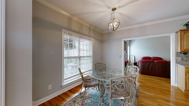 5142 Reagan Dr, Murfreesboro, TN 37129 - dining area with ornamental molding, light wood-type flooring, and a chandelier