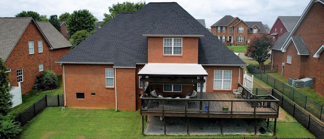 5142 Reagan Dr, Murfreesboro, TN 37129 - back of property with brick siding, a wooden deck, a fenced backyard, and a shingled roof