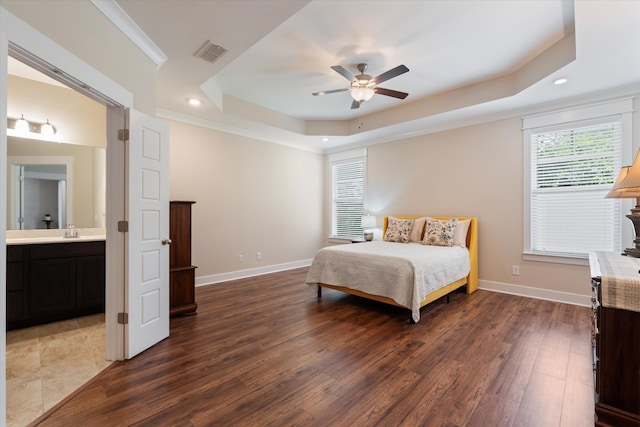 2129 Halfmoon Way, Murfreesboro, TN 37130 - bedroom featuring a tray ceiling, dark wood-style flooring, recessed lighting, ensuite bath, and crown molding