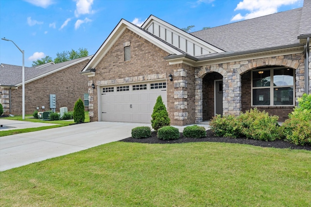 2129 Halfmoon Way, Murfreesboro, TN 37130 - view of front of property featuring a front yard, brick siding, concrete driveway, a garage, and roof with shingles