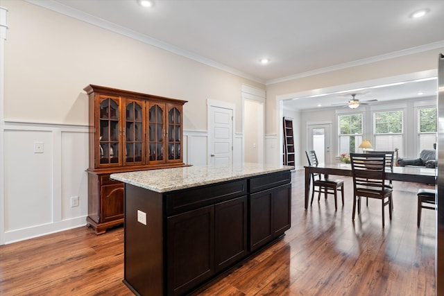 2129 Halfmoon Way, Murfreesboro, TN 37130 - kitchen featuring a decorative wall, dark wood-style flooring, glass insert cabinets, ceiling fan, and a wainscoted wall
