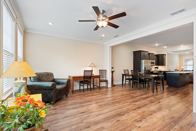 2129 Halfmoon Way, Murfreesboro, TN 37130 - living area with a ceiling fan, light wood finished floors, crown molding, and recessed lighting