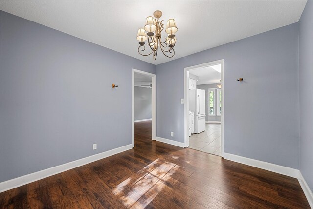 1731 Broadripple Dr, Clarksville, TN 37042 - spare room featuring a chandelier and wood finished floors