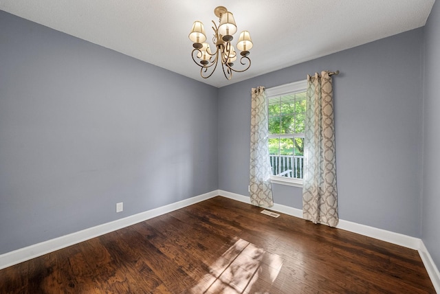 1731 Broadripple Dr, Clarksville, TN 37042 - spare room with a chandelier and wood finished floors