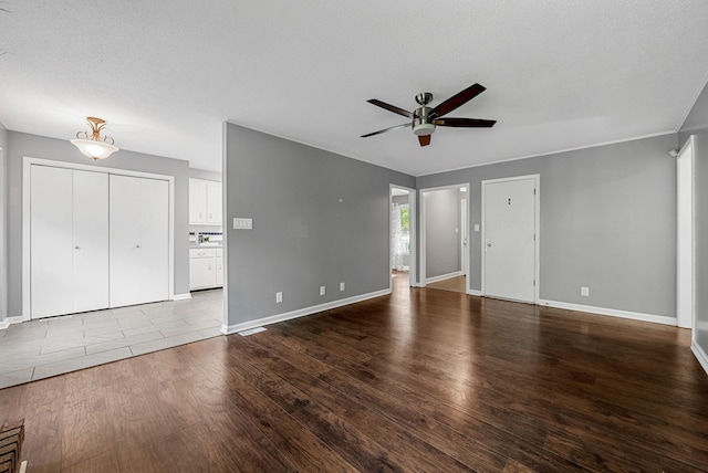 1731 Broadripple Dr, Clarksville, TN 37042 - unfurnished living room with a ceiling fan and dark wood-style flooring