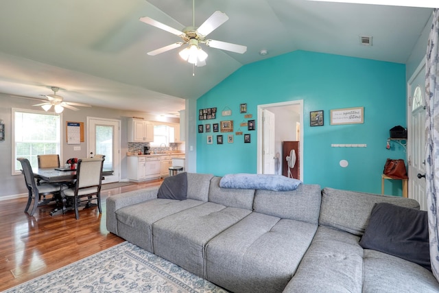 1944 Fieldstone Dr, Columbia, TN 38401 - living area featuring a ceiling fan, wood finished floors, vaulted ceiling, and healthy amount of natural light