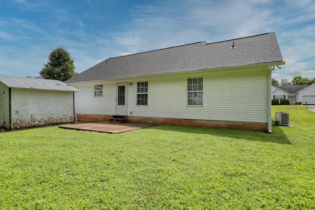 1944 Fieldstone Dr, Columbia, TN 38401 - rear view of house featuring a patio area, a yard, entry steps, and a shingled roof