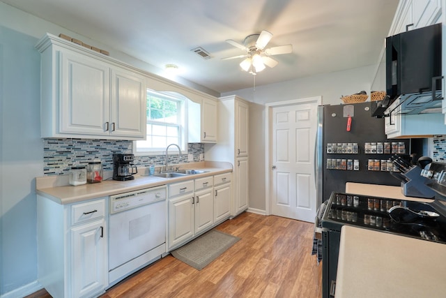 1944 Fieldstone Dr, Columbia, TN 38401 - kitchen featuring white dishwasher, electric range, a ceiling fan, backsplash, and white cabinetry