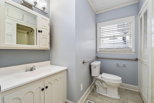 805 N Chancery St, Mcminnville, TN 37110 - bathroom featuring ornamental molding, vanity, a closet, wood finished floors, and a shower